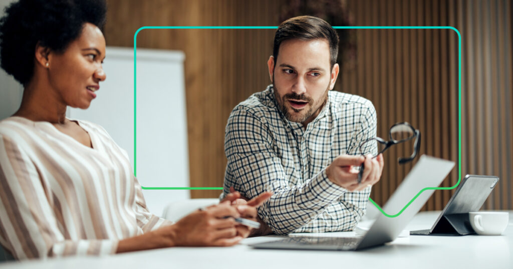man and woman discussing business