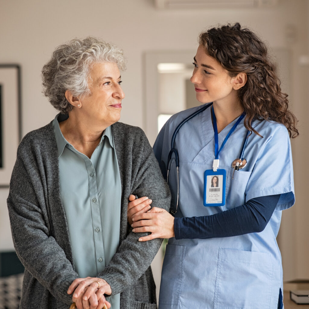 healthcare professional helping a patient